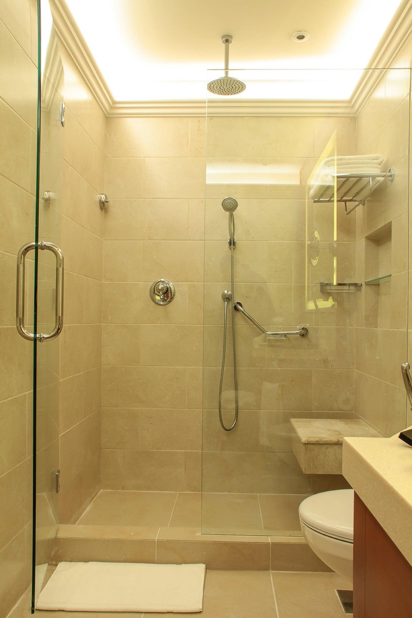 Thousand Nights Hotel Амман Экстерьер фото A shower with a shower head and handheld shower head